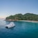 A catamaran docked near the shore of a secluded beach